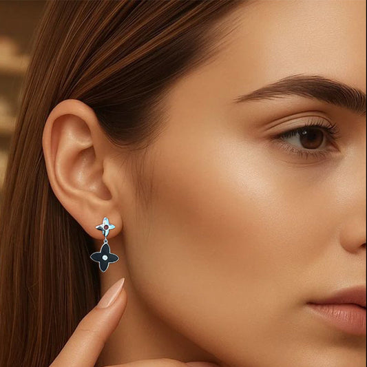 Close-up of a woman wearing a floral earring with a blurred background