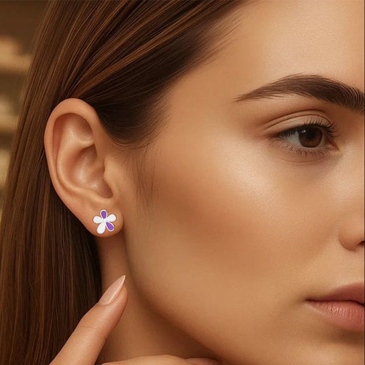 Close-up of a woman wearing a floral earring with a blurred background