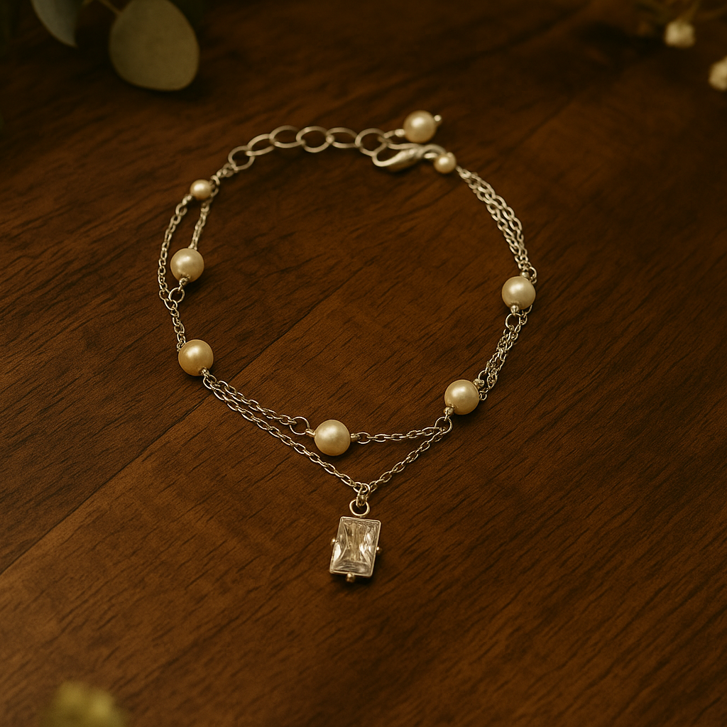 Bracelet with pearls and a diamond pendant on a wooden surface