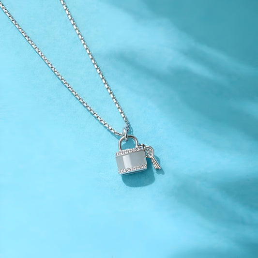 Necklace with a lock and key pendant on a light blue background