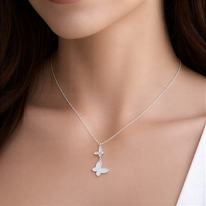 Silver butterfly necklace on a model