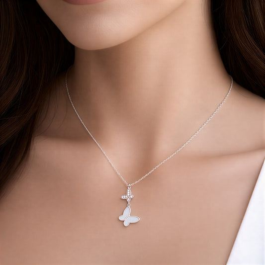 Silver butterfly necklace on a model