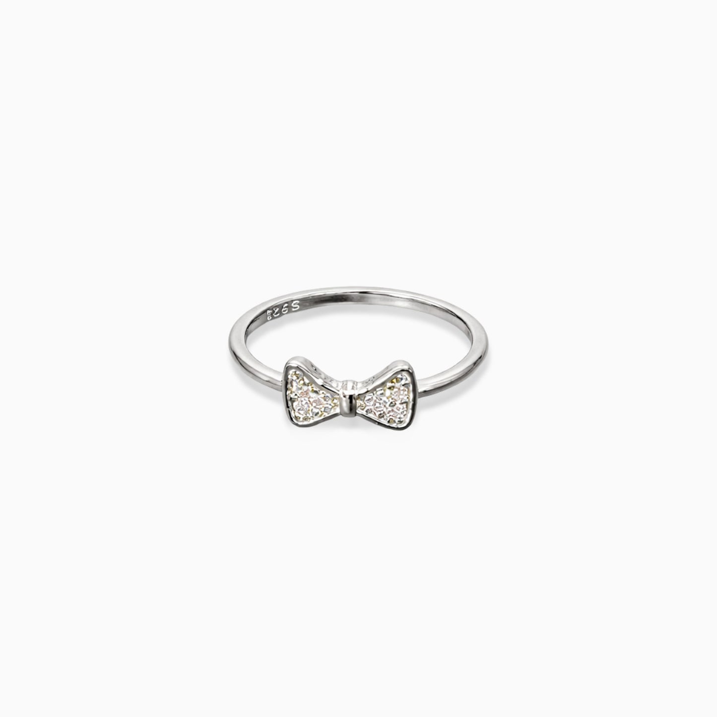 Silver ring with a bow design on a white background