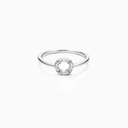 Silver ring with a circular design on a white background