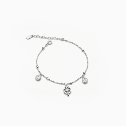 Silver bracelet with charms on a white background