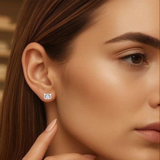 Close-up of a woman wearing a small earring with a blurred background