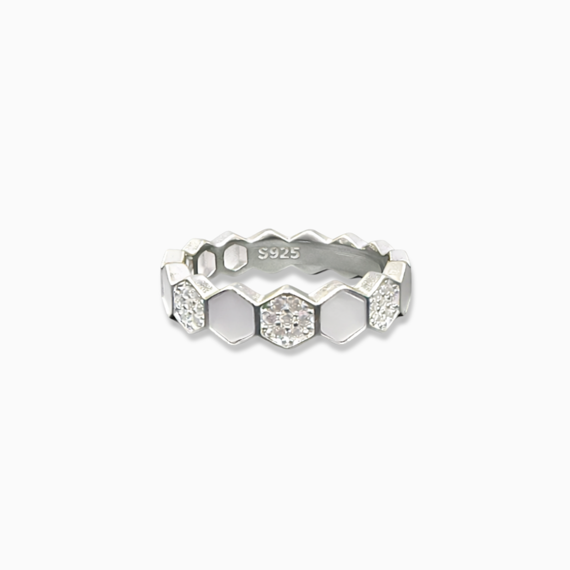 Silver ring with geometric design on a white background