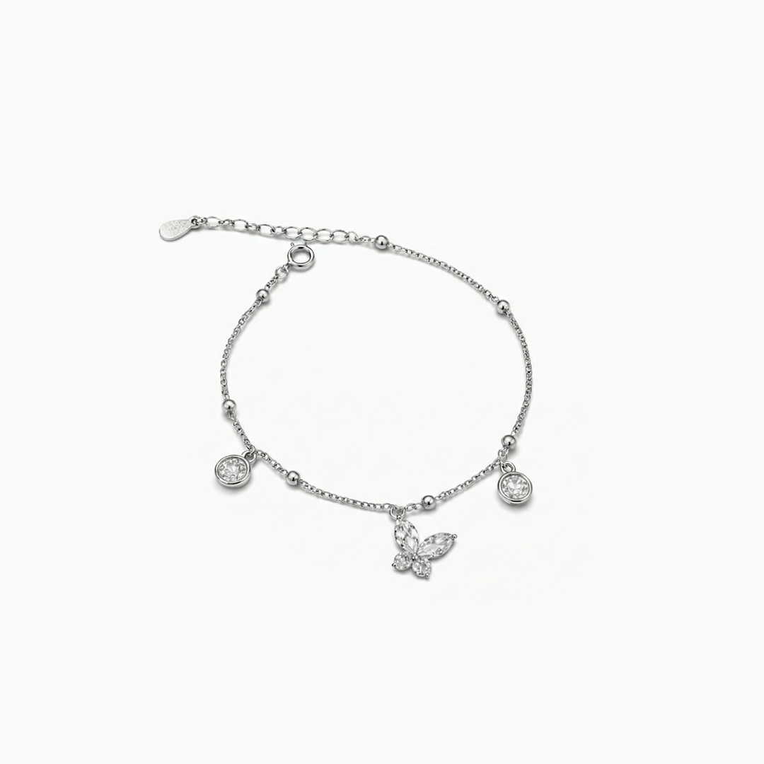 Silver bracelet with charms on a white background
