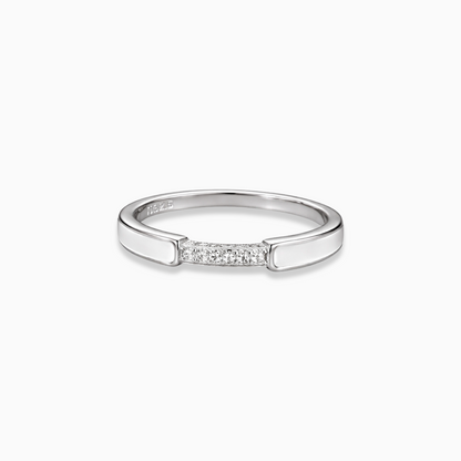 Silver ring with small diamonds on a white background
