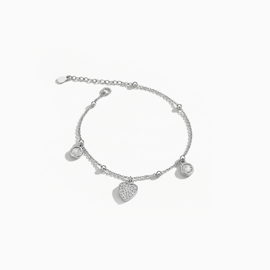 Silver bracelet with heart-shaped charms on a white background