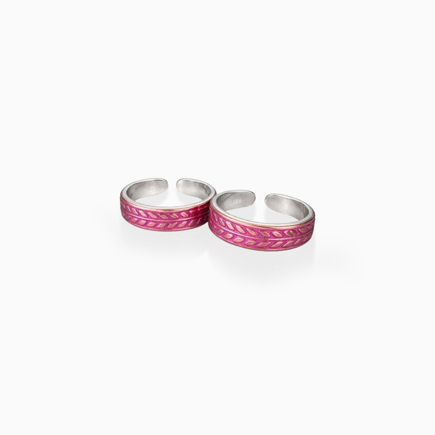 Two silver rings with pink inlay on a white background