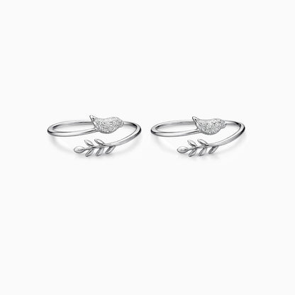 Pair of silver bird-shaped earrings on a white background