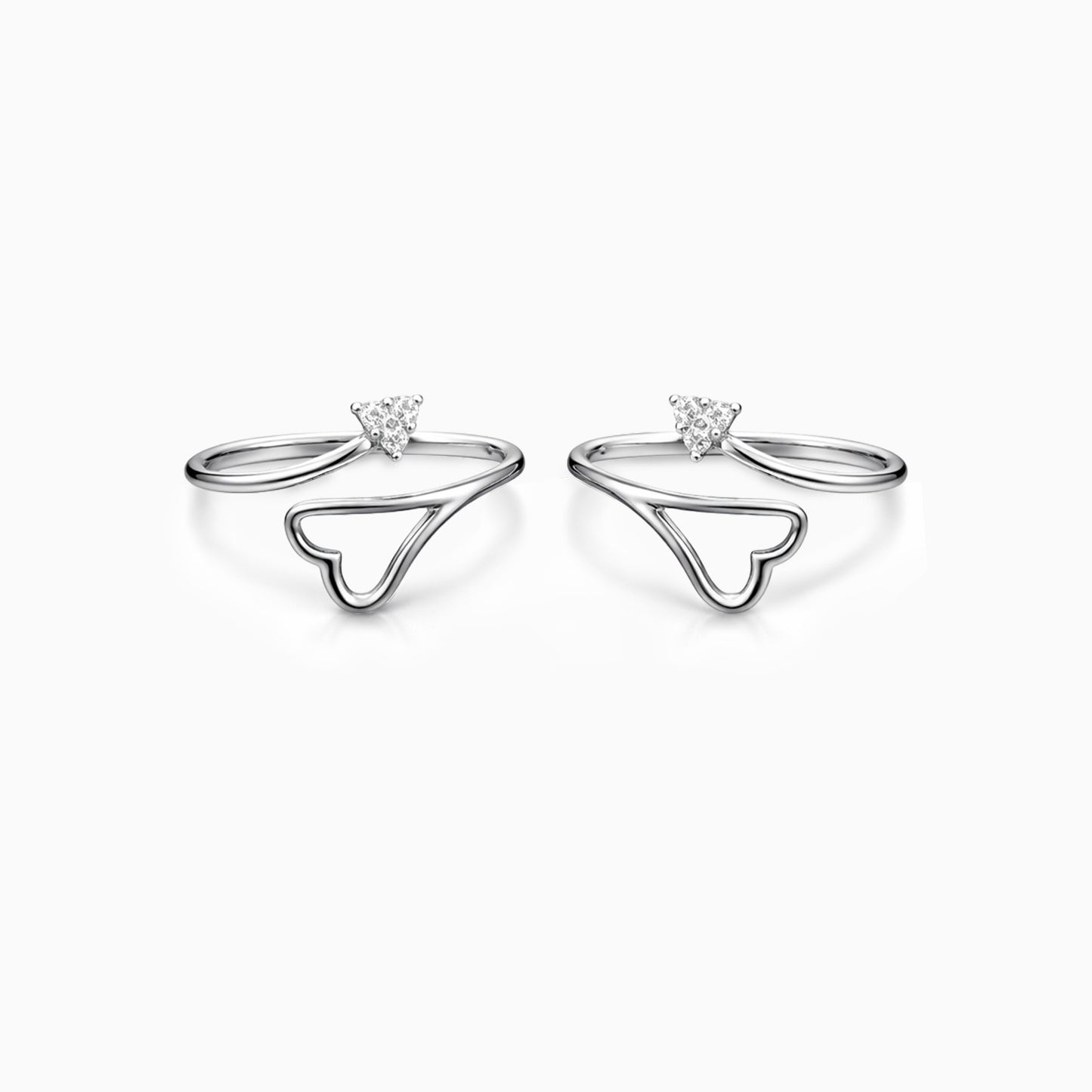 Silver ring with heart-shaped design and gemstone on a white background