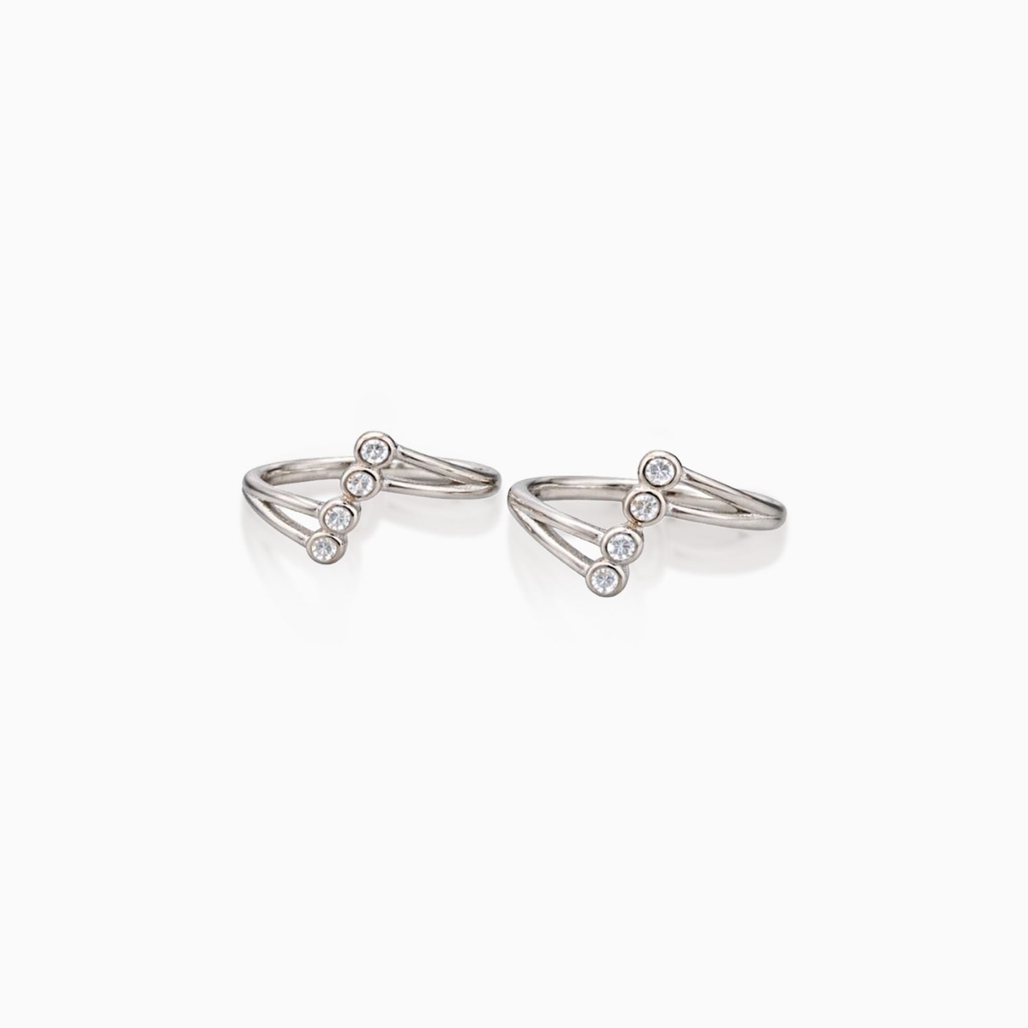 Pair of silver ring earrings on a white background