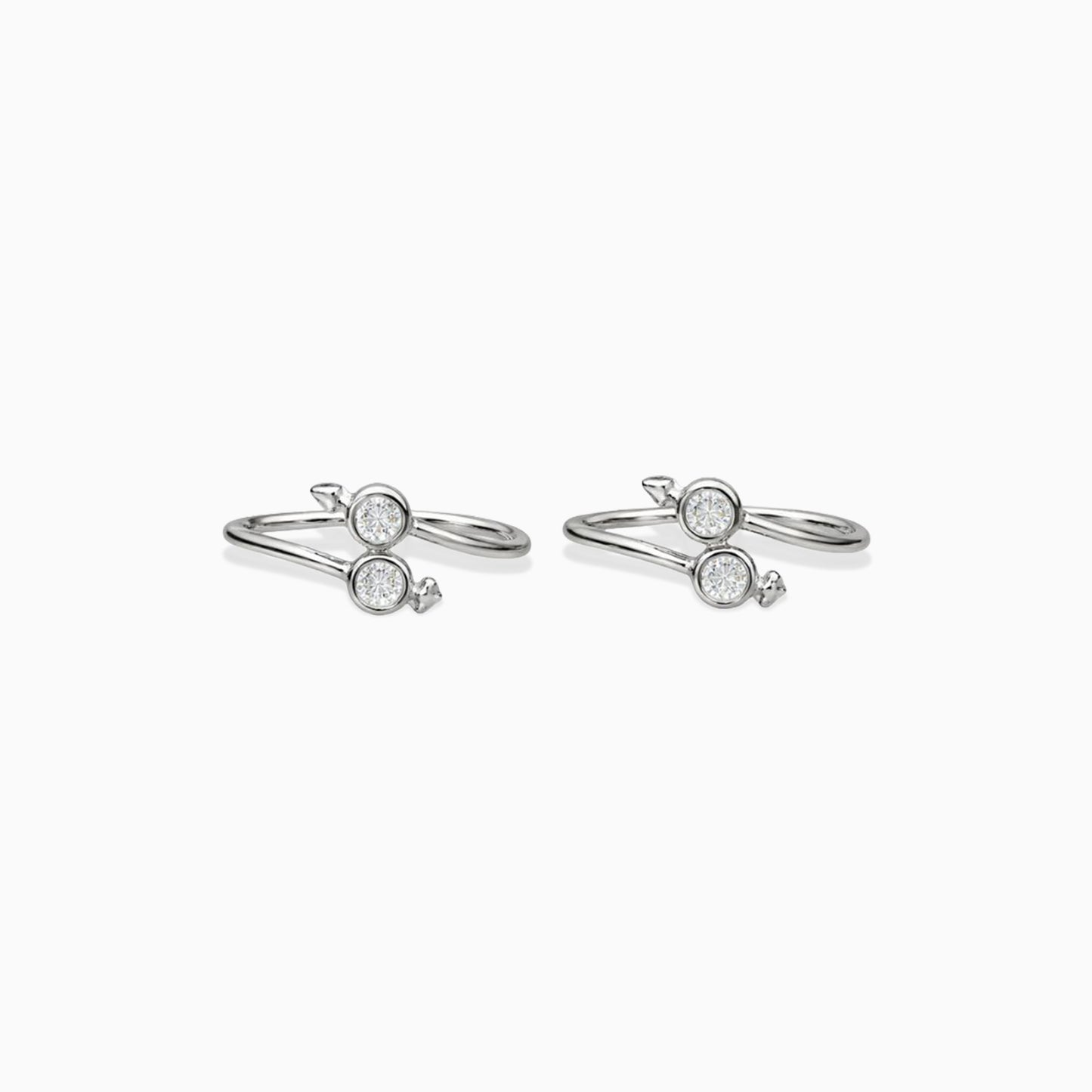 Pair of silver rings with gemstones on a white background