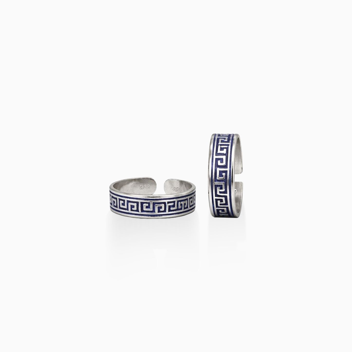Two silver cuff bracelets with blue and white pattern on a white background
