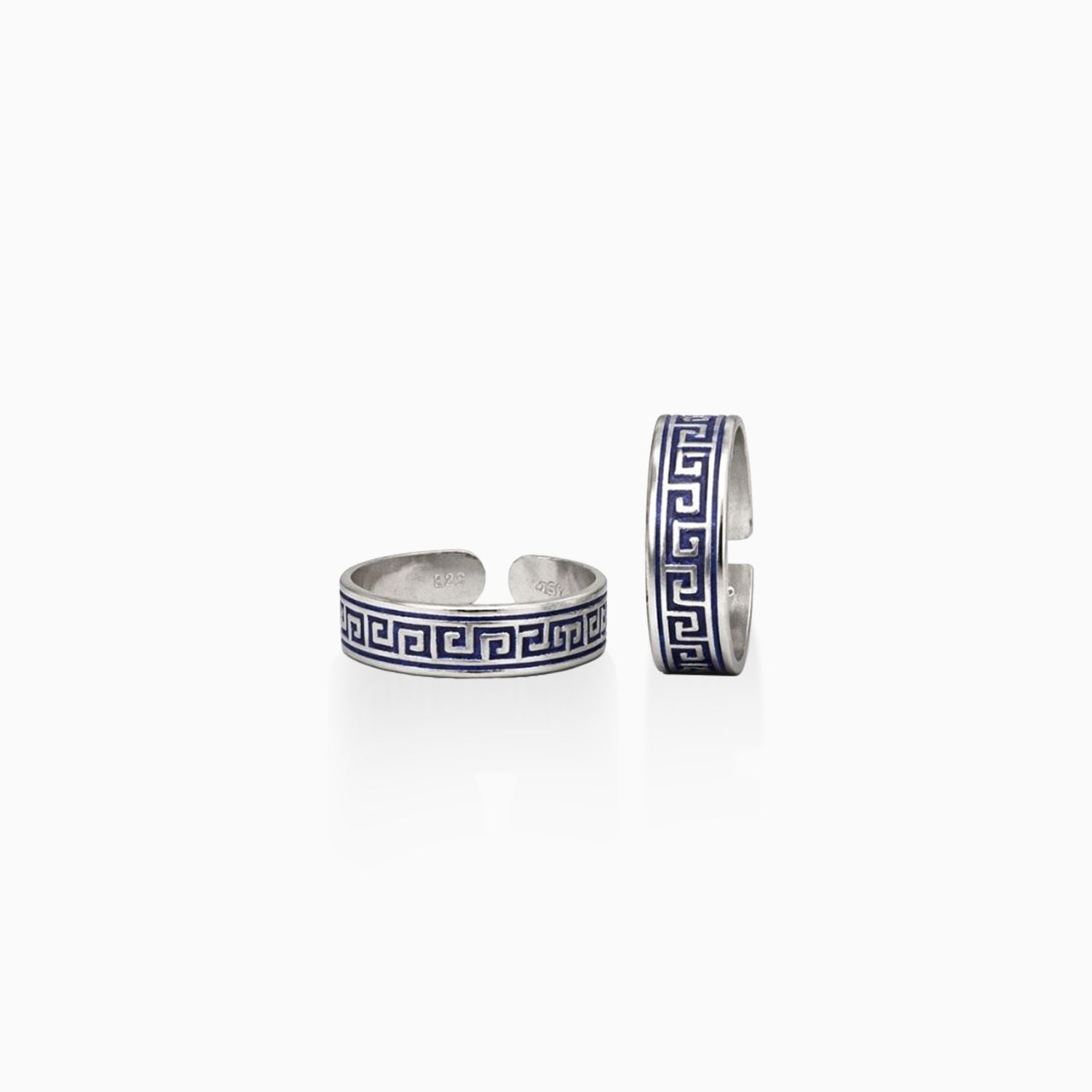 Two silver cuff bracelets with blue and white pattern on a white background