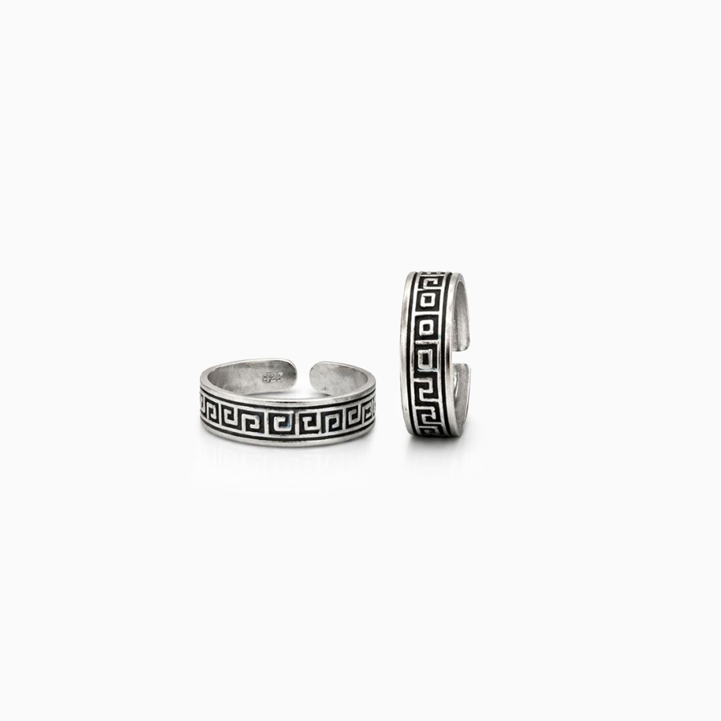 Two silver rings with Greek key design on a white background