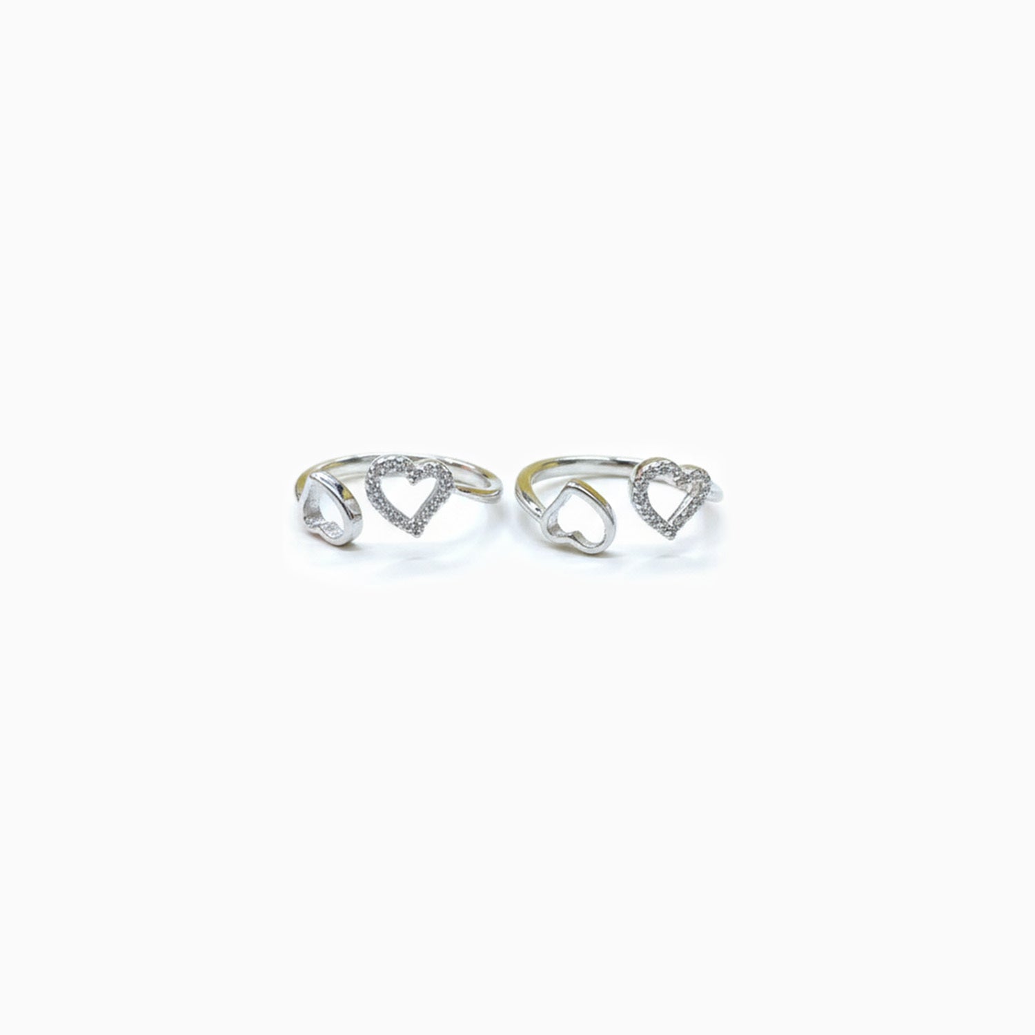 Pair of sterling silver heart design toe rings with zircon accents