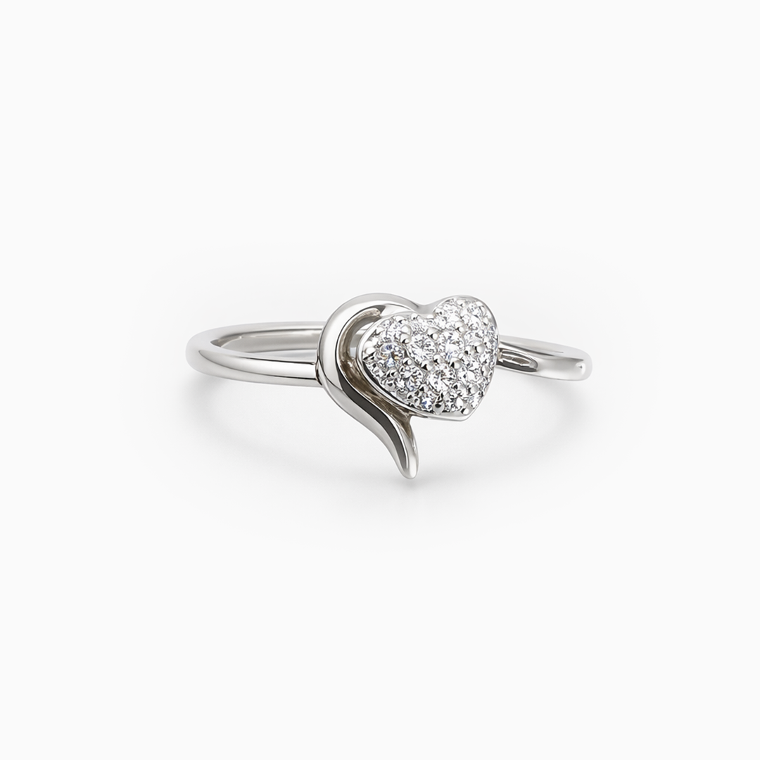 Silver ring with a heart-shaped diamond on a white background