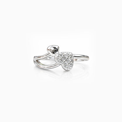 Silver ring with a heart-shaped design on a white background