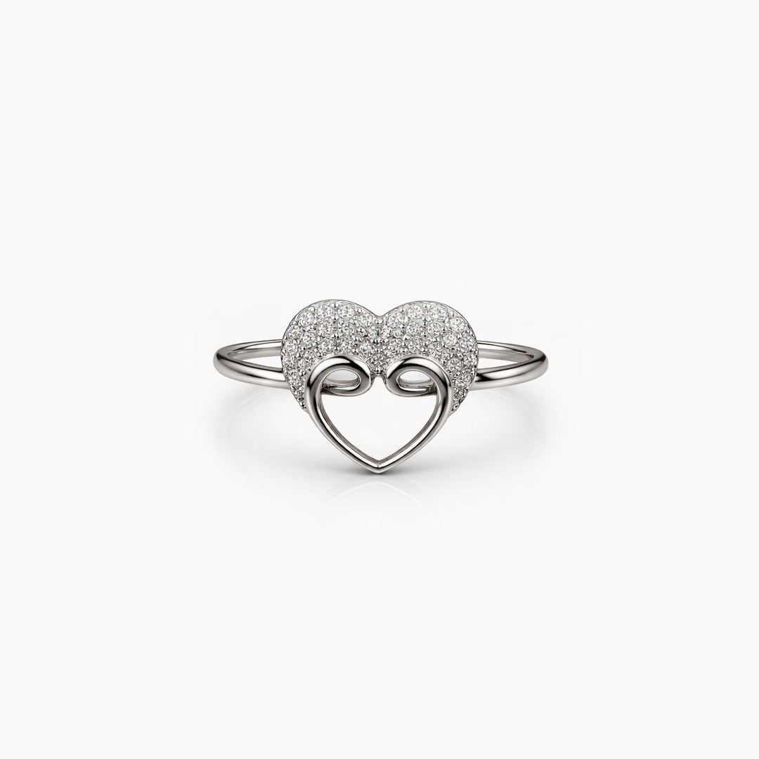 Silver heart-shaped ring with interlocking design on a white background
