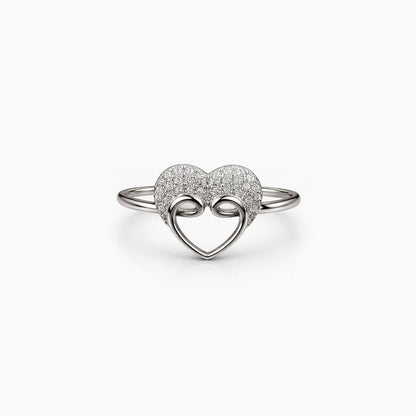 Silver heart-shaped ring with interlocking design on a white background