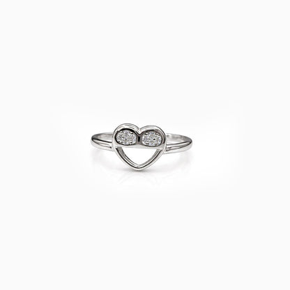 Heart-shaped ring with two diamonds on a white background