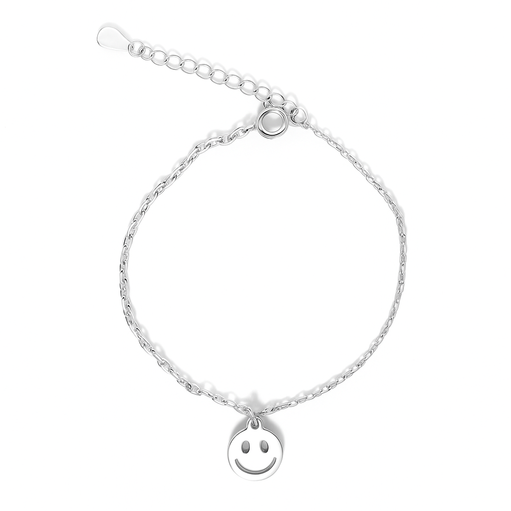 Silver bracelet with a smiley face charm on a white background.