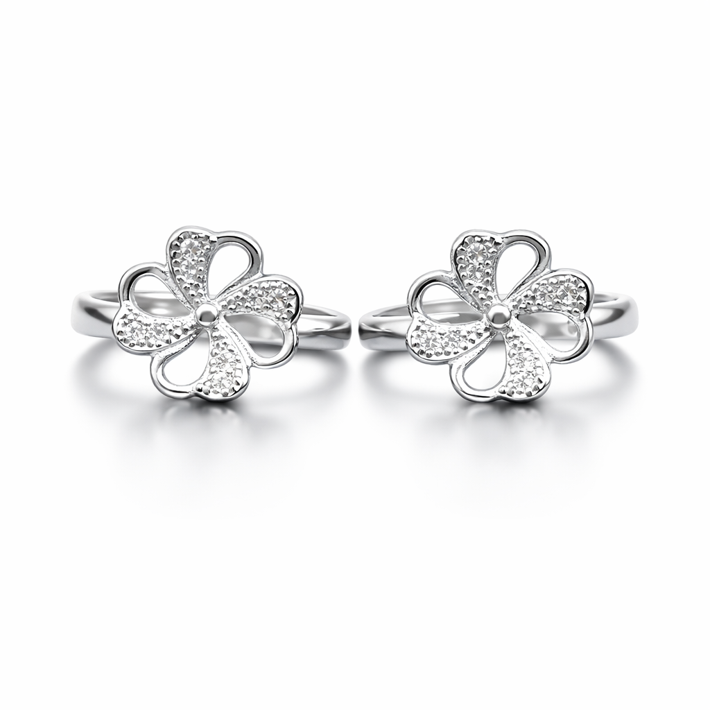 Pair of silver flower-shaped earrings on a white background
