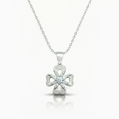 Silver four-leaf clover pendant necklace on a white background
