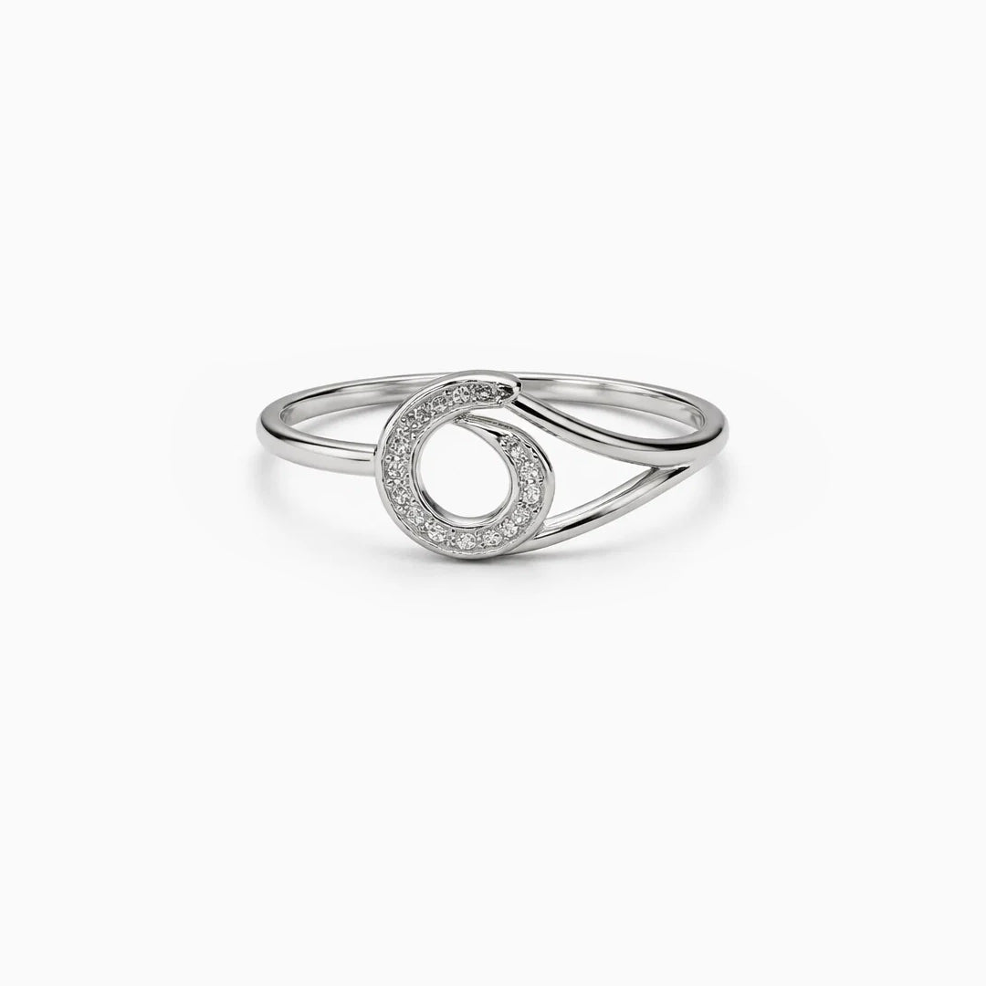 Silver ring with a circular design on a white background