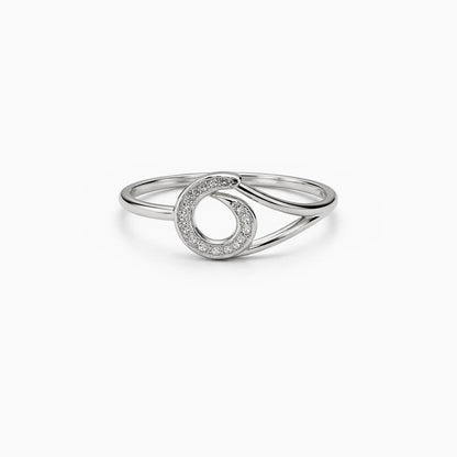 Silver ring with a circular design on a white background