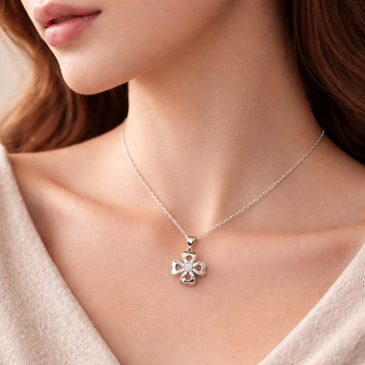 Silver necklace with a pendant worn by a model