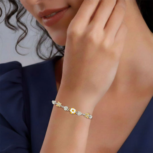 Close-up of a woman's wrist wearing a delicate bracelet with a blurred background